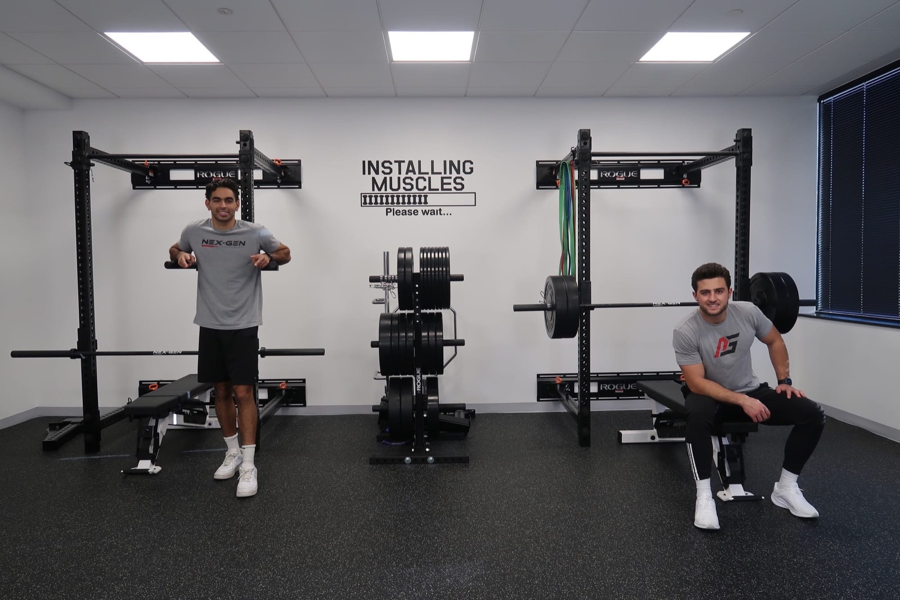 Nabil Milani and Andreas Tsaousis in the Nex-Gen gym studio with squat racks and plates